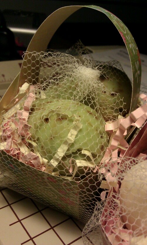 A return of the little baskets of soap eggs for spring is in the works.  Baskets made of fun double sided card stock (scrapbook paper), and filled with two eggs the size of a large hens egg, made in our most popular varieties.... here pictured are gardener's soap.