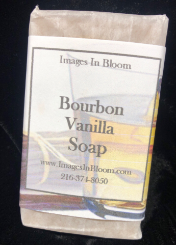A wrapped bar of Bourbon Vanilla soap with a label that includes the brand name 'Images In Bloom' and contact information.