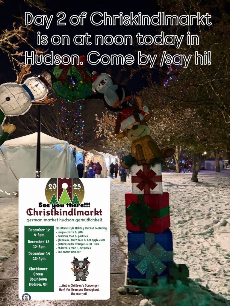 Festive scene at Chriskindlmarkt in Hudson, featuring illuminated decorations, snowmen, and gift boxes, with a promotional sign detailing event times and activities.