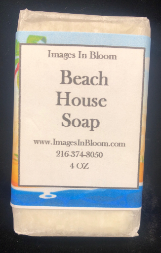 A bar of Beach House Soap with a label from Images In Bloom, featuring a blue background and text indicating the soap weight of 4 ounces.